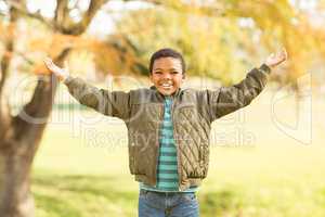 Portrait of a little boy with outstretched arms