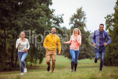 Friends jogging to the camera