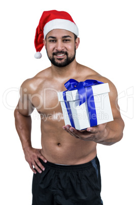 Muscular man in santa hat