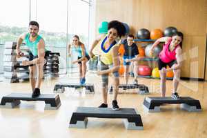 Fitness class exercising in the studio