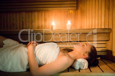 Pretty woman relaxing in the sauna