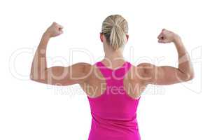 Rear view of muscular woman flexing muscles