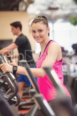 Fit people working out using machines