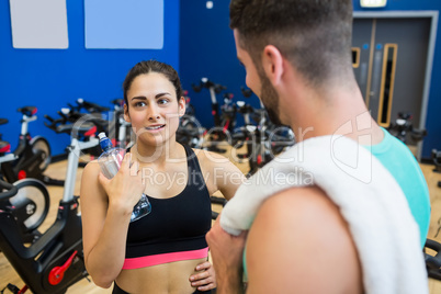 Focused couple discussing workout plan