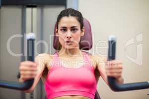 Determined woman working out