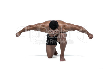 Muscular man flexing for camera