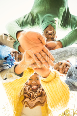 Young family doing a head circles and joining their hands
