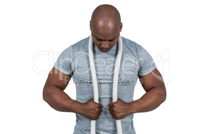 Fit man with battle rope