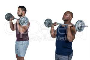 Two muscular men lifting barbell