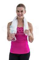 Portrait of pretty smiling woman with water bottle