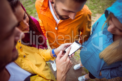 Friends using a smartphone on hike