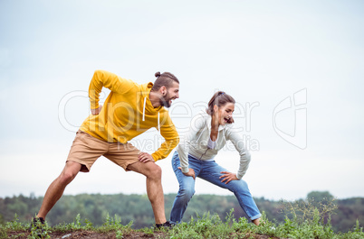 Couple stretching on a hike