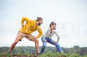 Couple stretching on a hike