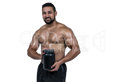 Muscular man with protein powder