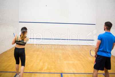 Couple play some squash together