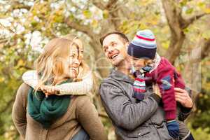 Smiling young family looking each other