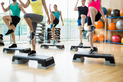 Fitness class exercising in the studio