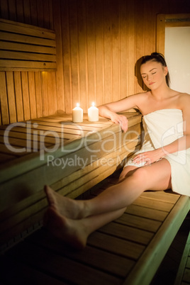 Pretty woman relaxing in the sauna