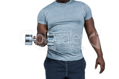 Fit man exercising with dumbbell