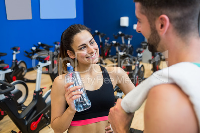 Focused couple discussing workout plan
