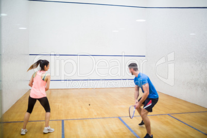 Couple play some squash together