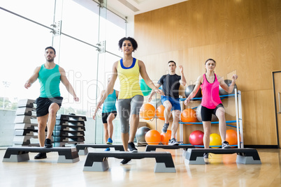 Fitness class exercising in the studio