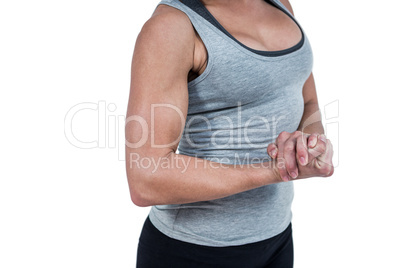 MId section of muscular woman flexing muscle