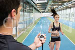 Trainer timing woman on the track