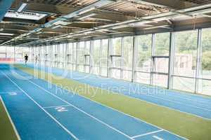 Couple running on the indoor track