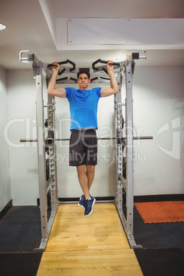 Fit man doing pull ups