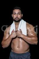Portrait of a bodybuilder man with a towel
