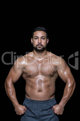 Portrait of a bodybuilder man flexing muscles