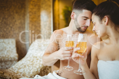 Romantic couple together with champagne glasses