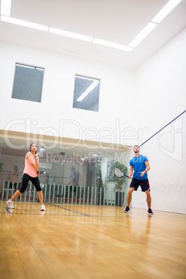 Couple playing a game of squash