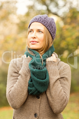 Smiling pretty woman holding her scarf