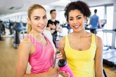 Fit women smiling at the camera