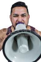 Muscular man yelling through a megaphone