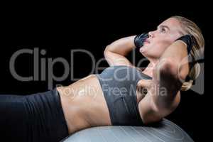 Muscular woman doing sit ups