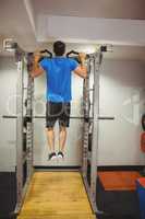 Fit man doing pull ups