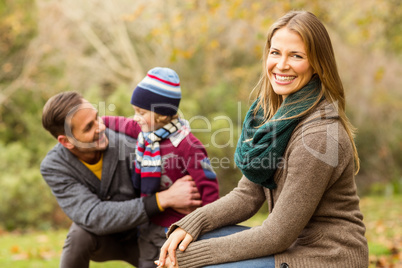 Smiling young couple with little boy posing Smiling young couple with little boy posing