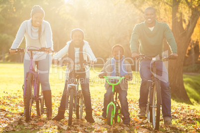 Young smiling family doing a bike ride