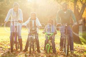 Young smiling family doing a bike ride
