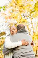 Peaceful happy senior couple embracing