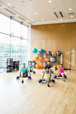 Fitness class exercising in the studio