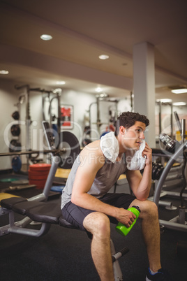 Fit man taking a break from working out