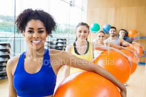 Fitness class exercising in the studio