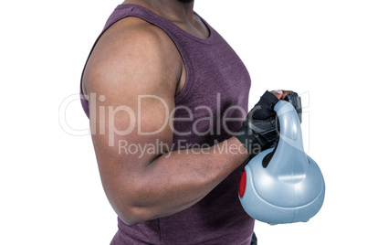 Fit man exercising with kettlebell