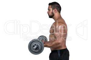 Muscular man lifting heavy barbell