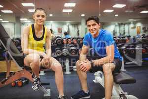 Fit couple smiling at camera