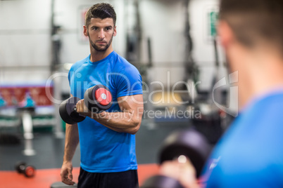 Man using weights in his workout